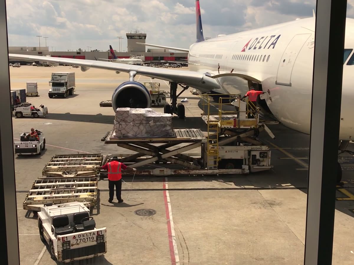Cargo being loaded onto a freight aircraft